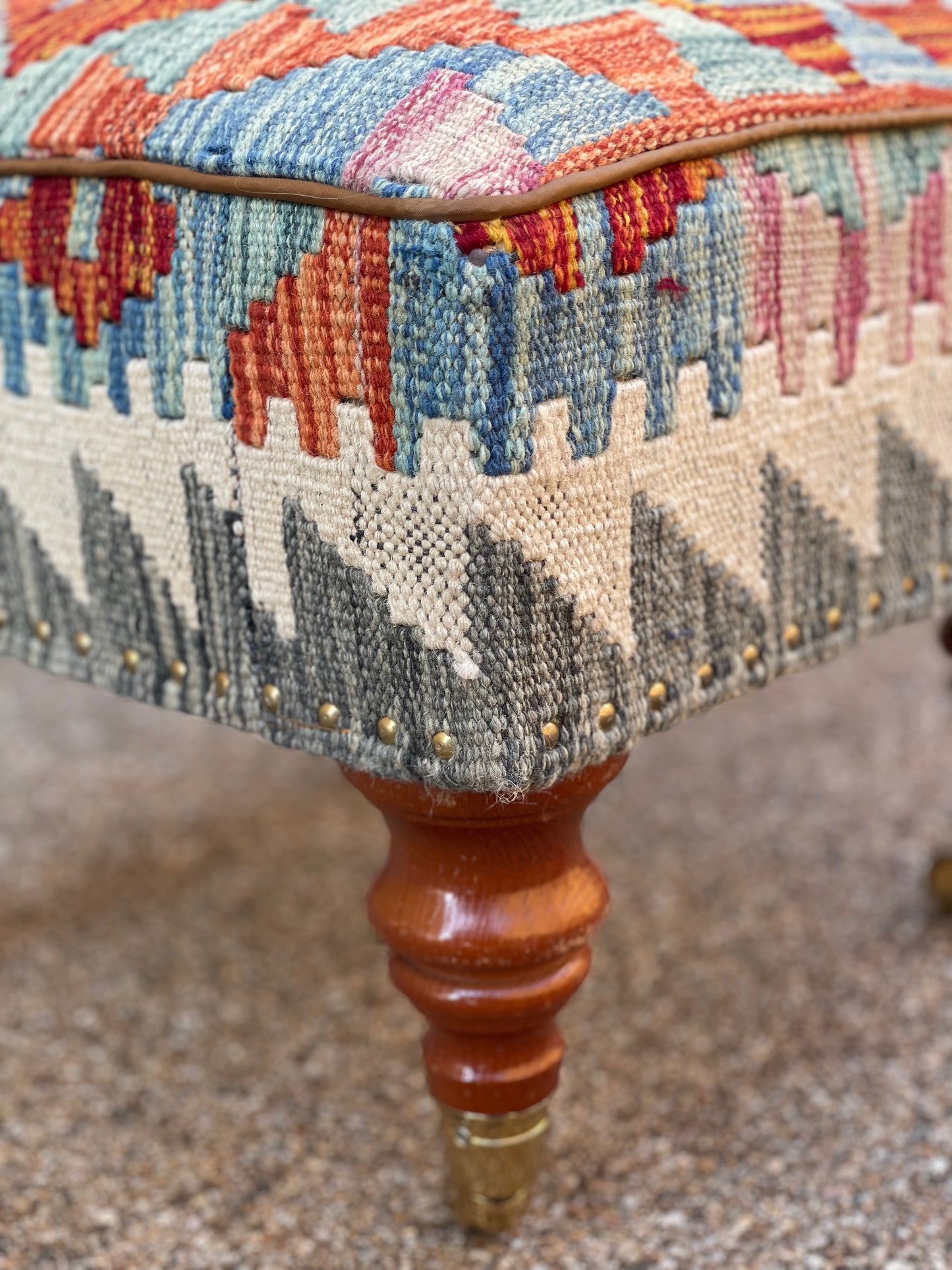 Kilim upholstered Ottoman/Stool on Brass Castors