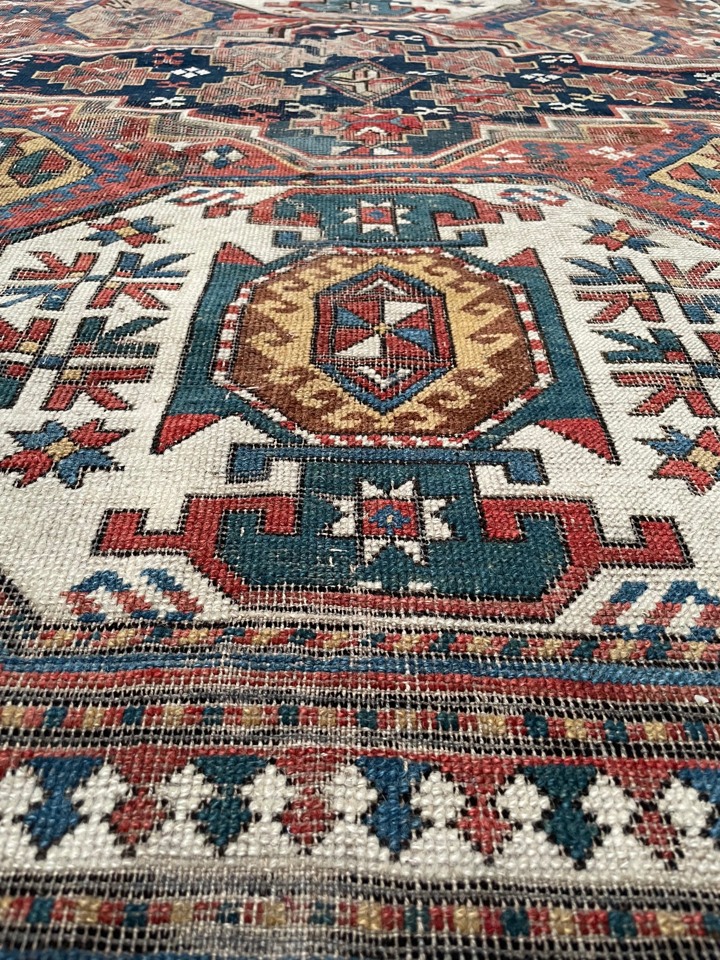 Antique Caucasian Triple Medallion Kazak Rug
