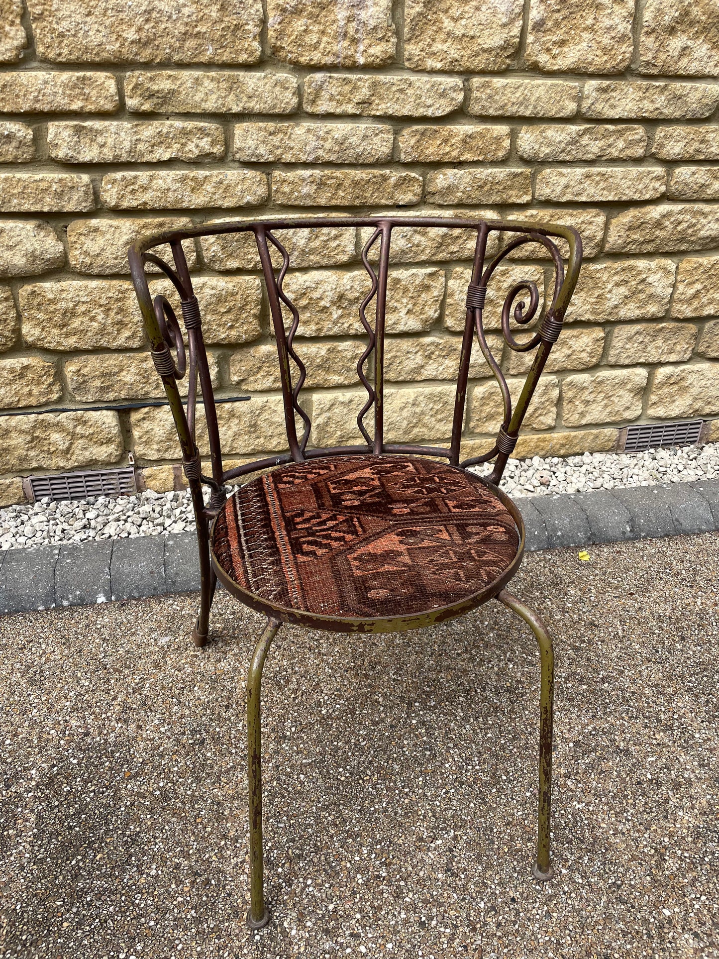 Quirky Wrought Iron Artisan Scrolling back Chair - Seat Upholstered in Antique Rug